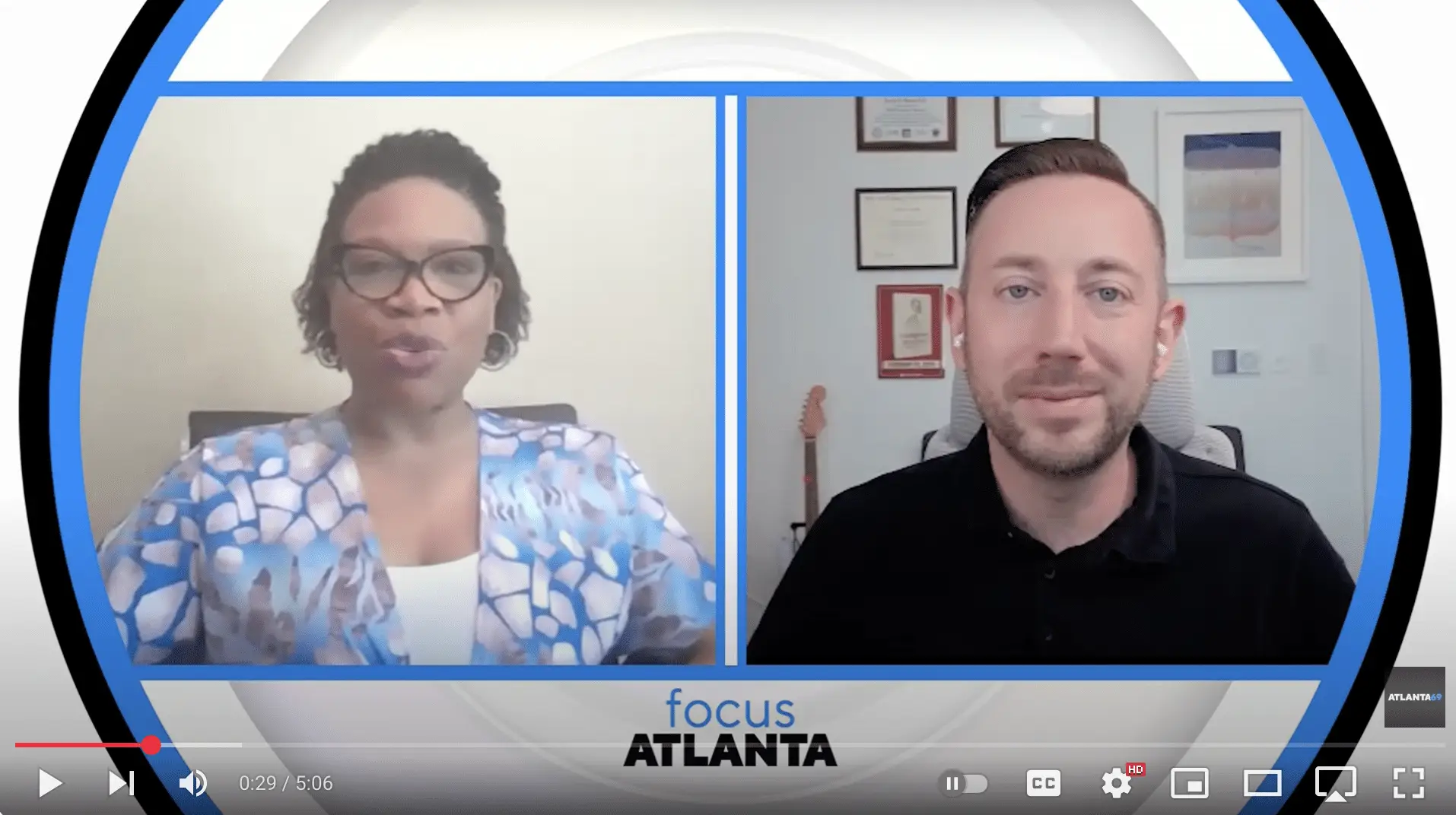 Two people in a video interview.